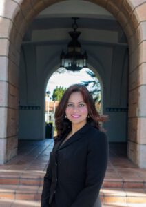 Woman in a black suit in front of SDSU's Hepner Hall